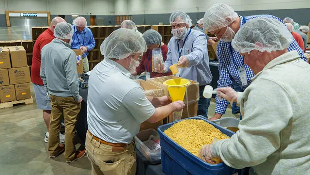 Volunteers packing meals