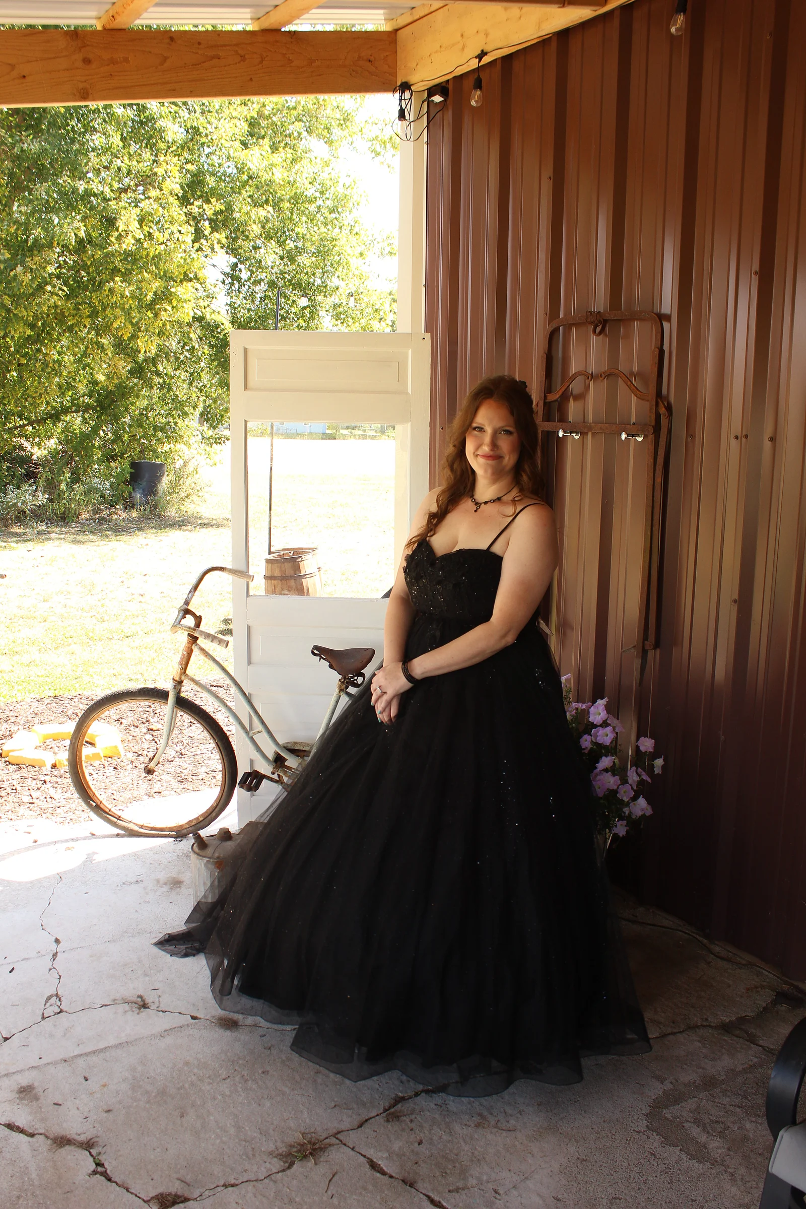 The bride by the barn with the bicycle