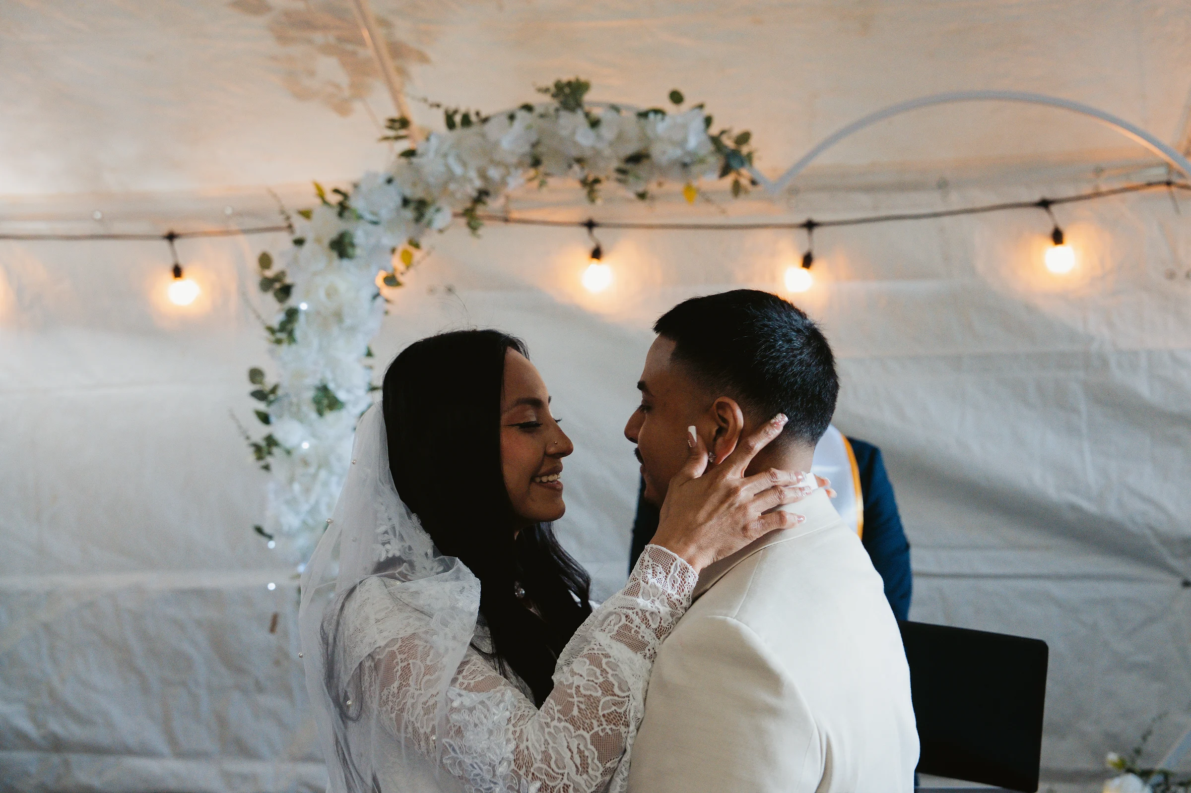 Her hands on his face after the vows