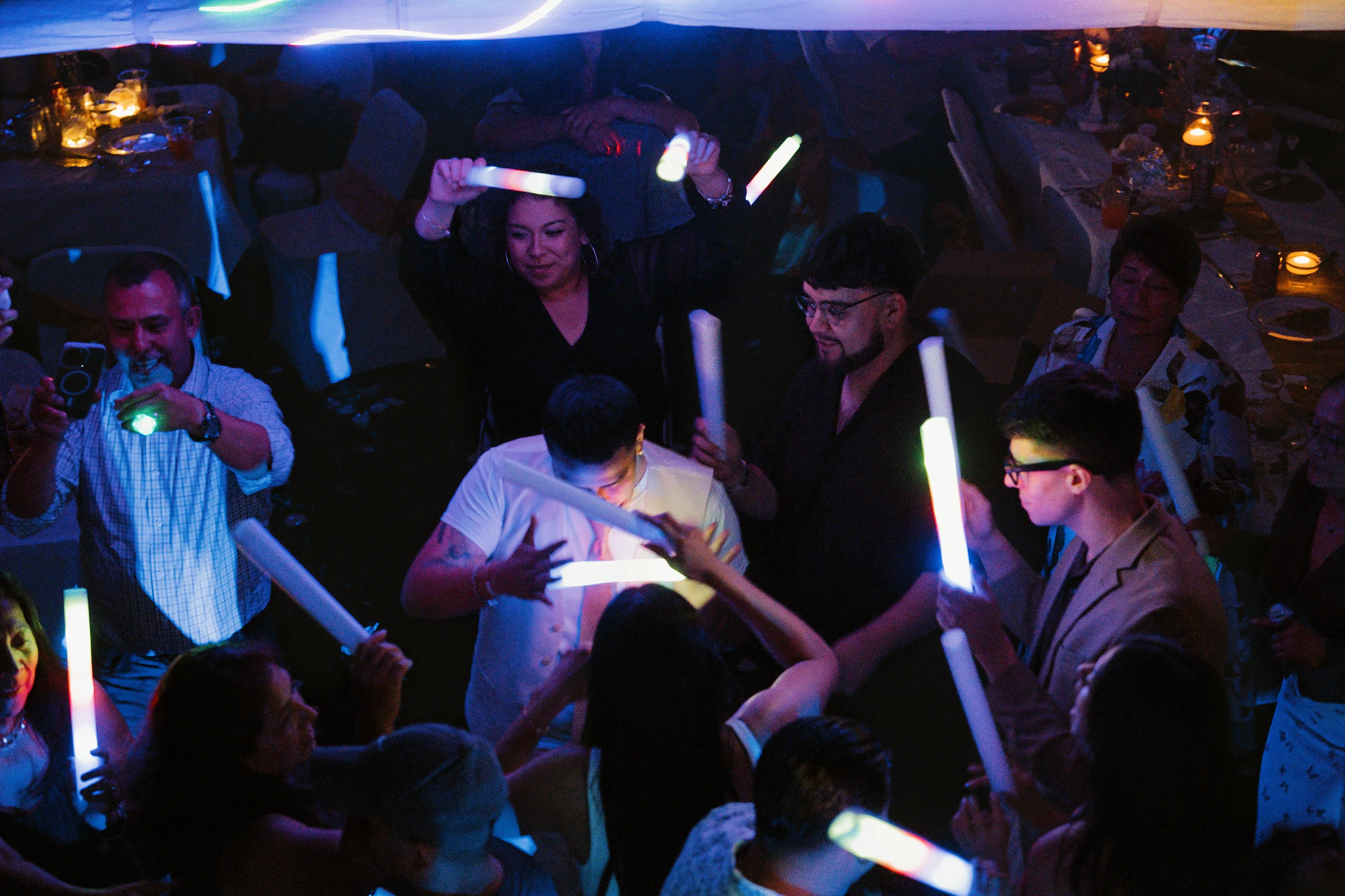 The dance floor, glow sticks up