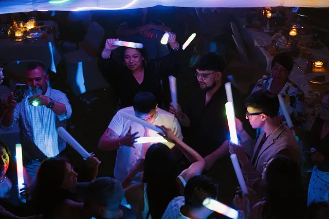 The dance floor, glow sticks up