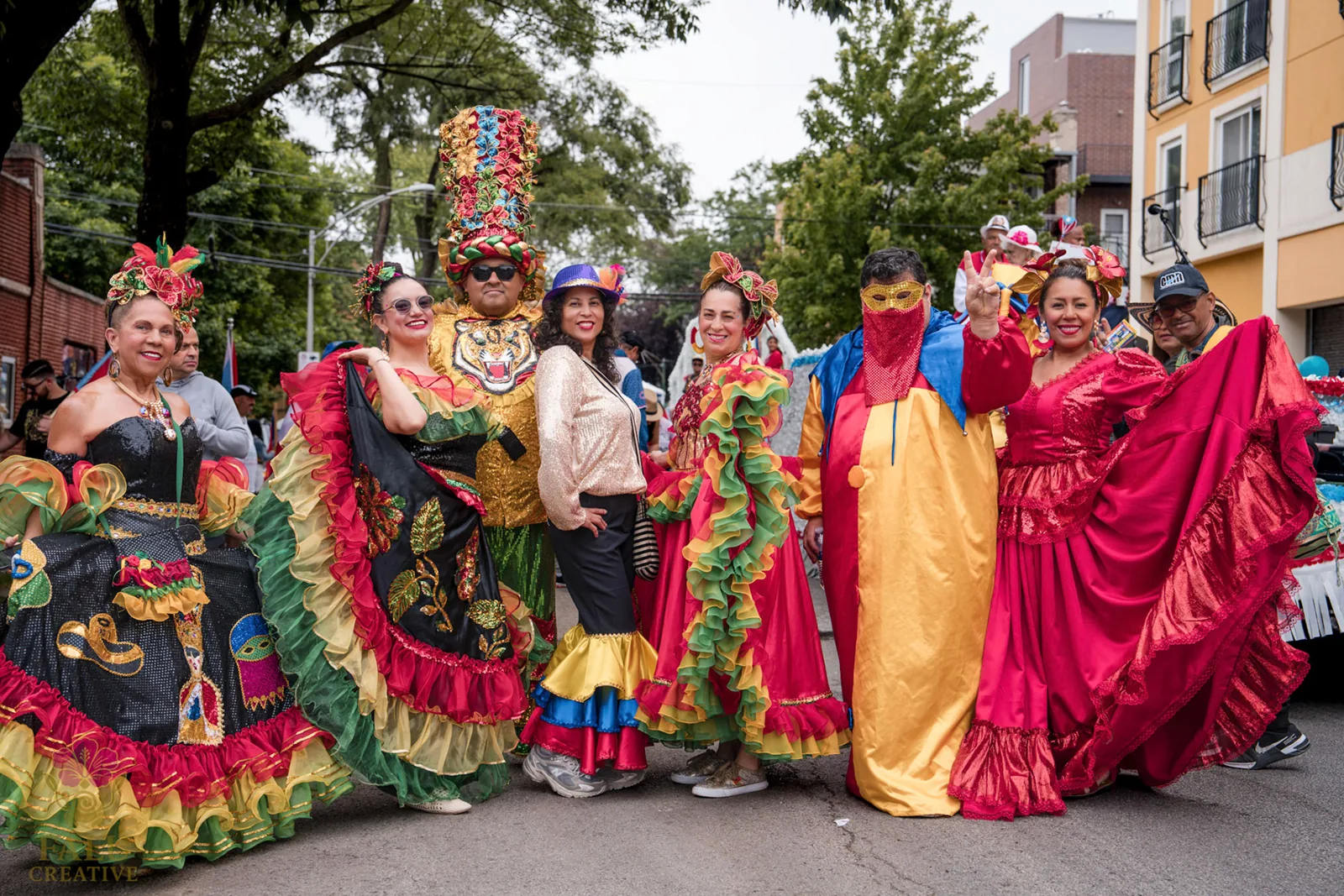 Puerto Rican Parade participants in colorful dresses on a Chicago street