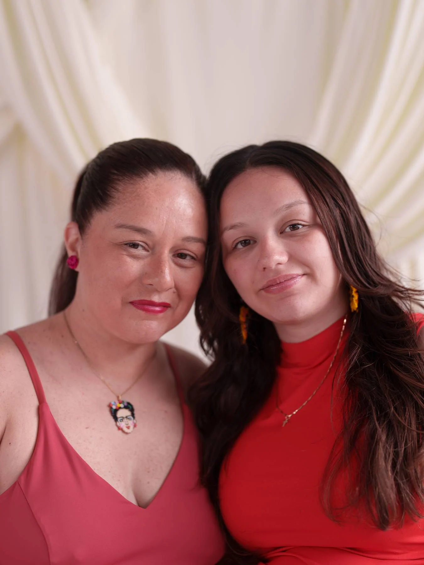 A mother and her daughter in red