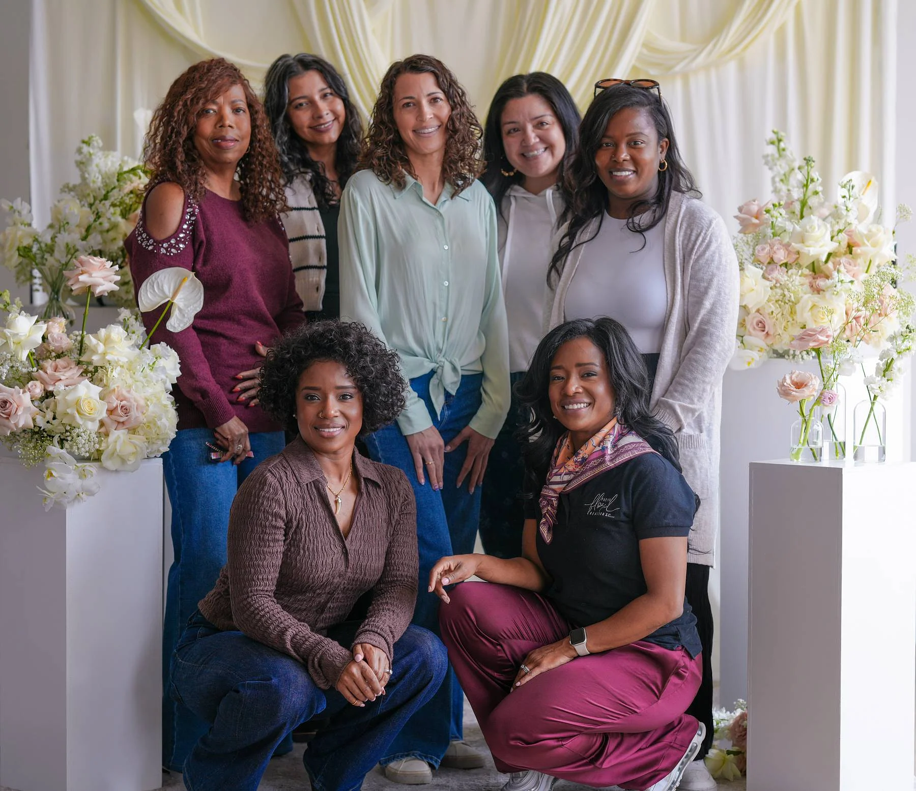 The whole group by the flowers