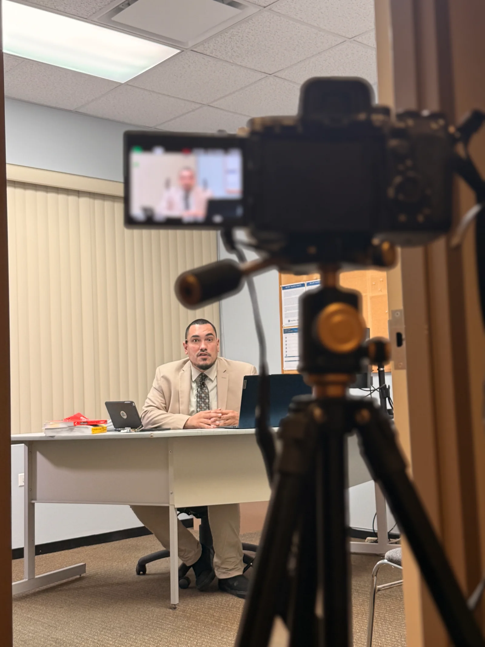 Sony camera and its flip-out screen frame Kon seated during a shoot